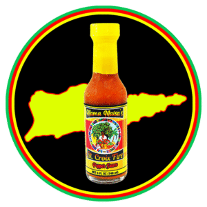 A bottle of hot sauce with a vibrant label and yellow cap, set against an island silhouette.